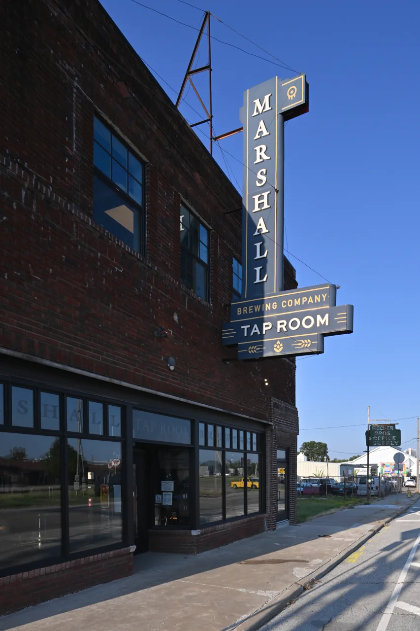 Marshall Brewing Company tap room sign and brick building on East 6th Street in Tulsa